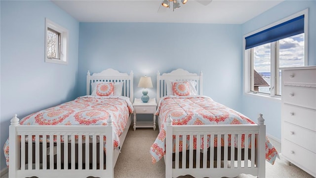 367 Waters Edge, Owasco, NY 13021 - carpeted bedroom with multiple windows and ceiling fan