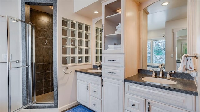 367 Waters Edge, Owasco, NY 13021 - ensuite bathroom featuring a shower stall, vanity, and recessed lighting