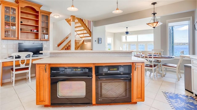 367 Waters Edge, Owasco, NY 13021 - kitchen with a ceiling fan, light countertops, decorative light fixtures, and black oven