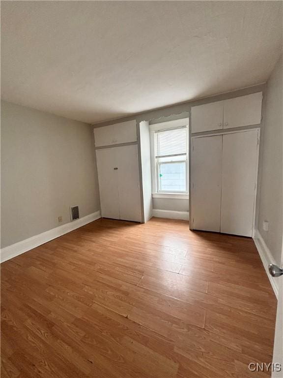 149 River St, Rome-Inside, NY 13440 - unfurnished bedroom with light wood finished floors, visible vents, and baseboards