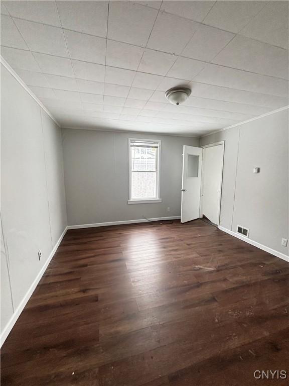 149 River St, Rome-Inside, NY 13440 - empty room with crown molding, visible vents, baseboards, and wood finished floors