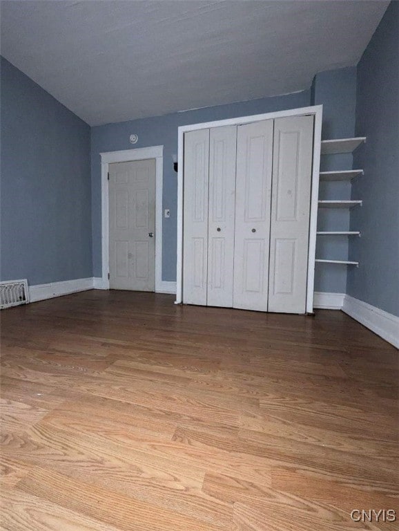 149 River St, Rome-Inside, NY 13440 - unfurnished bedroom featuring visible vents, baseboards, a closet, and wood finished floors