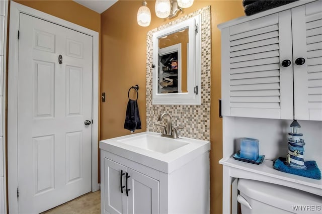 bathroom featuring tile patterned floors, vanity, and backsplash