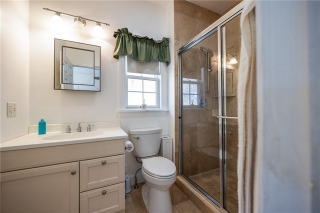 5572 Lakewood Trl, South Bristol, NY 14424 - full bath with tile patterned floors, vanity, a stall shower, and toilet