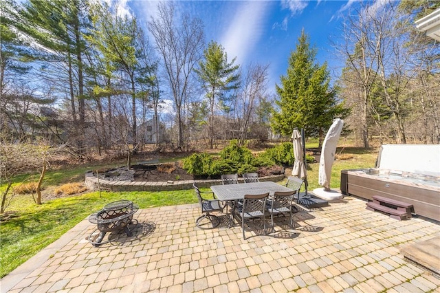 5572 Lakewood Trl, South Bristol, NY 14424 - view of patio / terrace with outdoor dining space, a fire pit, and a hot tub