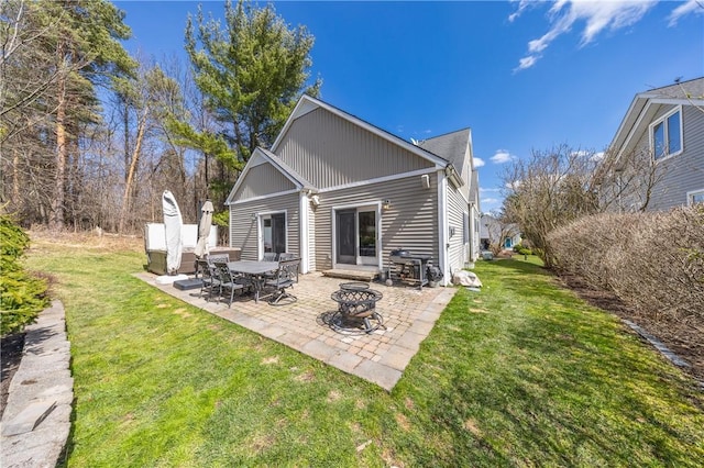 5572 Lakewood Trl, South Bristol, NY 14424 - back of house featuring an outdoor fire pit, a yard, and a patio area