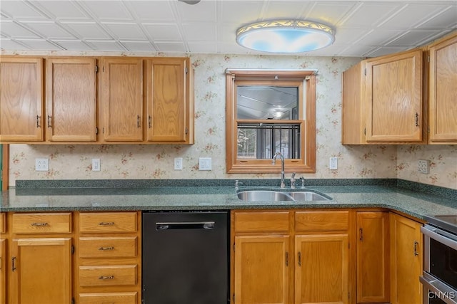 kitchen with dishwasher, a sink, wallpapered walls, stainless steel range with electric cooktop, and dark stone counters