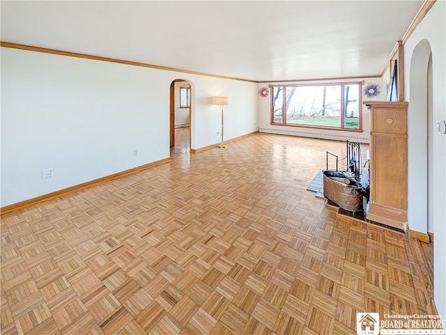 unfurnished living room with crown molding, a baseboard radiator, baseboards, and arched walkways