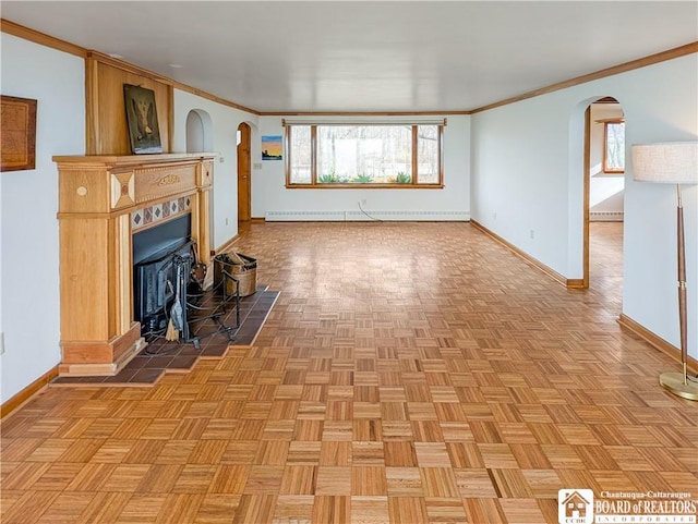 unfurnished living room with crown molding, baseboards, arched walkways, and baseboard heating