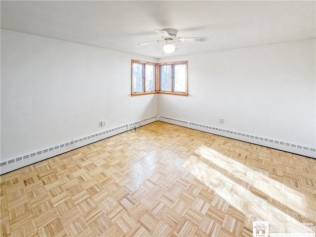 unfurnished room with baseboards and a ceiling fan