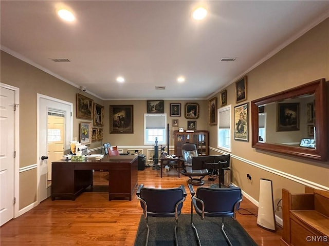 office area featuring recessed lighting, visible vents, ornamental molding, and wood finished floors