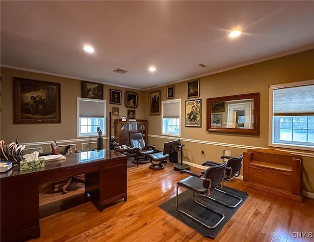 office area featuring visible vents, baseboards, ornamental molding, recessed lighting, and wood finished floors