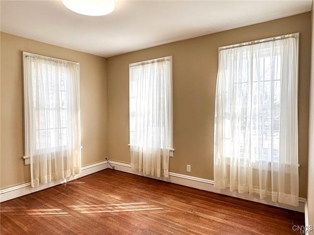 spare room featuring baseboards