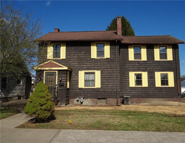 956 Hoffman St, Elmira-City, NY 14905 - view of front of property with a chimney, a front yard, and central AC