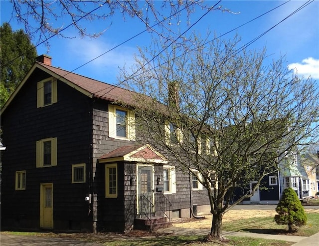 956 Hoffman St, Elmira-City, NY 14905 - view of front of house with a chimney