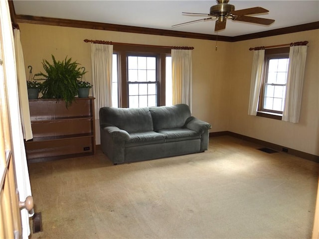 956 Hoffman St, Elmira-City, NY 14905 - living room featuring crown molding, ceiling fan, light carpet, and visible vents