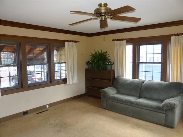 956 Hoffman St, Elmira-City, NY 14905 - living area with visible vents, light colored carpet, baseboards, and ceiling fan