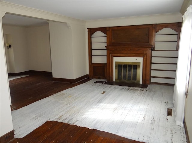 956 Hoffman St, Elmira-City, NY 14905 - unfurnished living room with crown molding, wood-type flooring, baseboards, and a fireplace with flush hearth