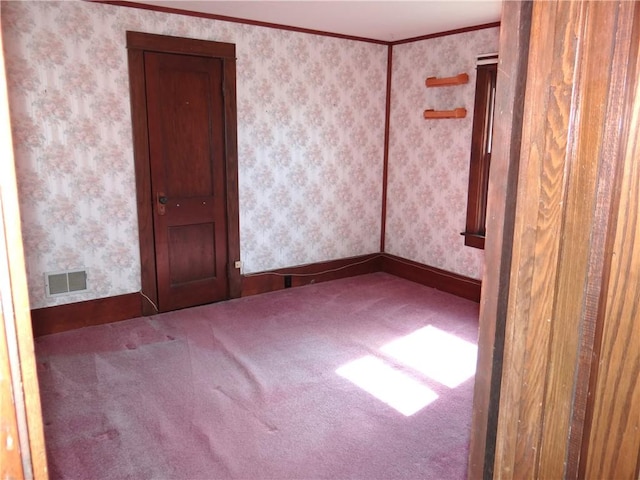 956 Hoffman St, Elmira-City, NY 14905 - carpeted empty room featuring wallpapered walls, baseboards, and visible vents