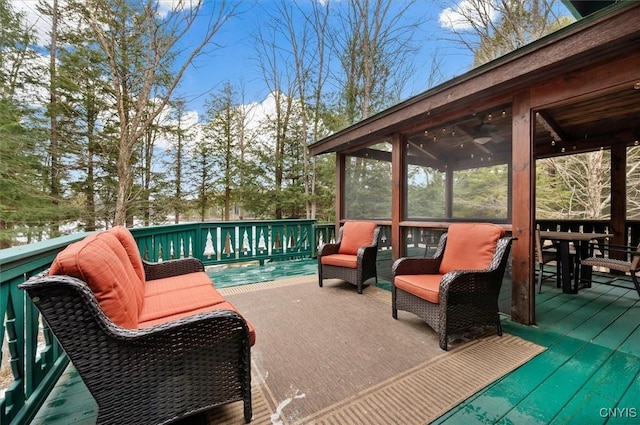 wooden deck with a sunroom