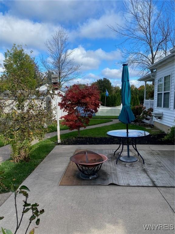 253 Glenvale Rd, Porter, NY 14174 - view of patio / terrace featuring an outdoor fire pit and fence