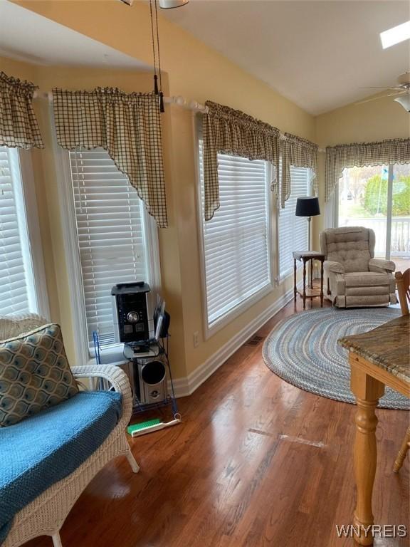 253 Glenvale Rd, Porter, NY 14174 - living area with wood finished floors, ceiling fan, and baseboards