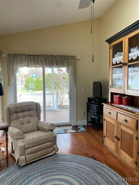 253 Glenvale Rd, Porter, NY 14174 - living area featuring dark wood-type flooring, ceiling fan, baseboards, and lofted ceiling