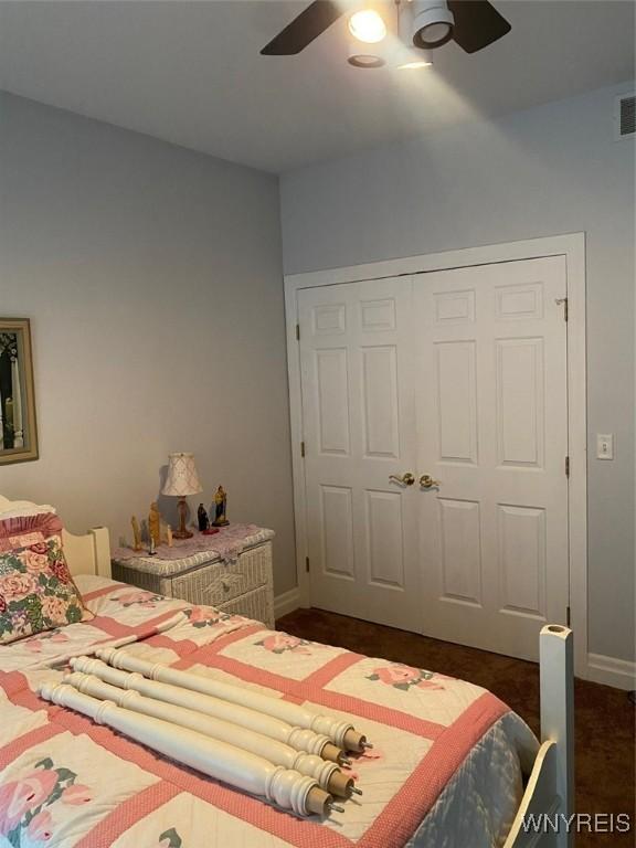 253 Glenvale Rd, Porter, NY 14174 - bedroom with a closet, ceiling fan, and baseboards