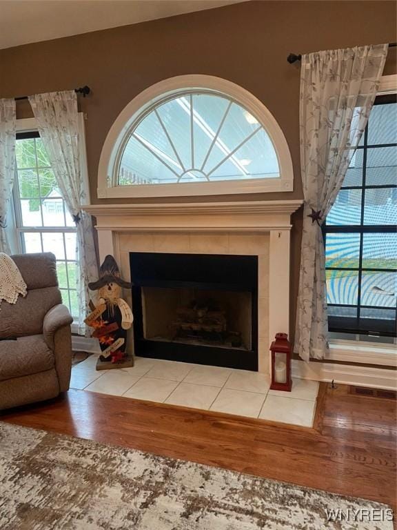 253 Glenvale Rd, Porter, NY 14174 - details with a tile fireplace and wood finished floors