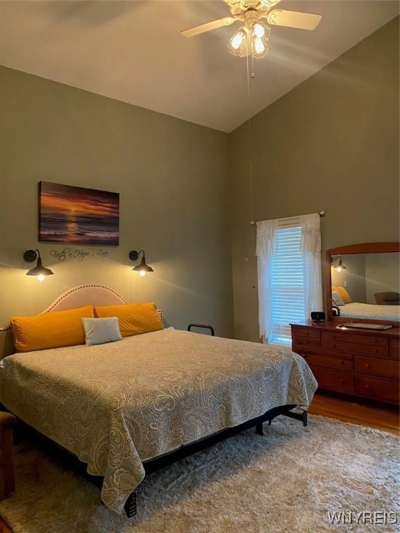 253 Glenvale Rd, Porter, NY 14174 - bedroom featuring ceiling fan, wood finished floors, and lofted ceiling