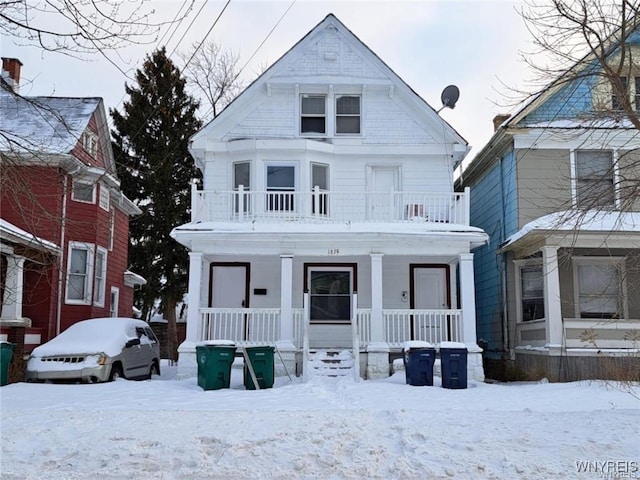 view of front facade with a porch and a balcony