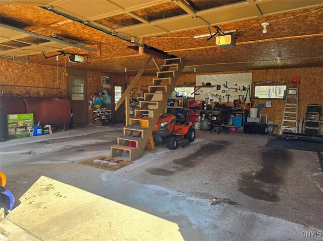 3012 Pleasant Ave, Vienna, NY 13308 - garage featuring a garage door opener and heating fuel