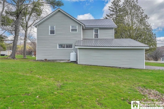 9056 Gross Rd, Cuba, NY 14727 - back of house featuring metal roof and a lawn