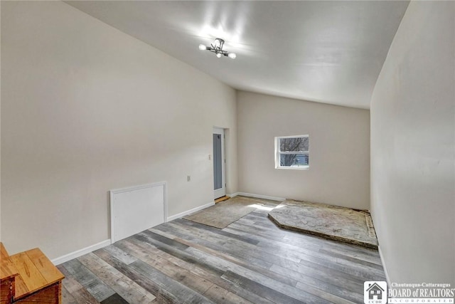 9056 Gross Rd, Cuba, NY 14727 - unfurnished room featuring baseboards, wood finished floors, and lofted ceiling