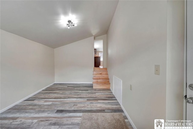 9056 Gross Rd, Cuba, NY 14727 - spare room with baseboards, wood finished floors, and lofted ceiling