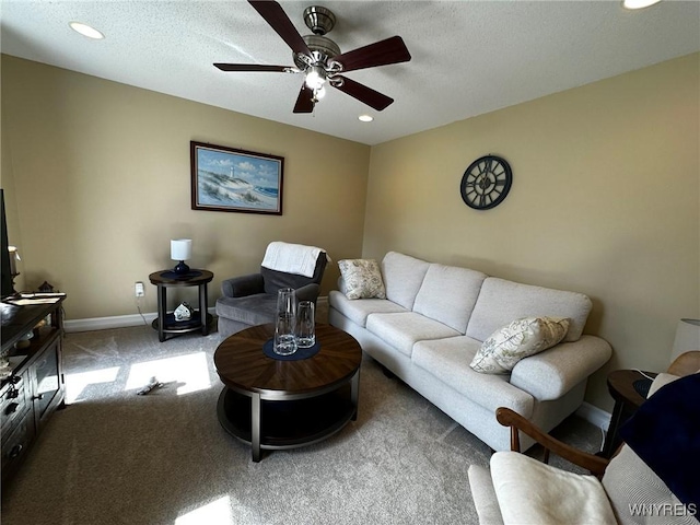 carpeted living area with recessed lighting, baseboards, and ceiling fan