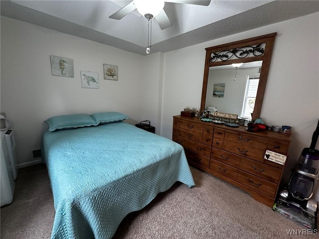 carpeted bedroom featuring visible vents and ceiling fan
