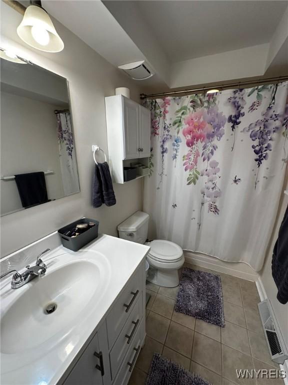full bath with vanity, tile patterned flooring, a shower with curtain, toilet, and visible vents