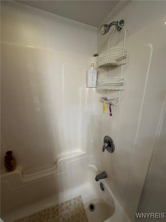bathroom with shower / tub combination