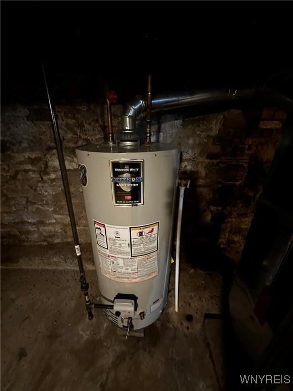utility room featuring gas water heater