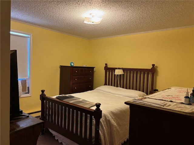 bedroom featuring crown molding, dark carpet, baseboard heating, and a textured ceiling