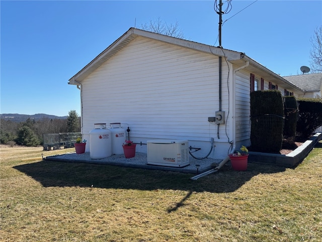 view of home's exterior with a yard