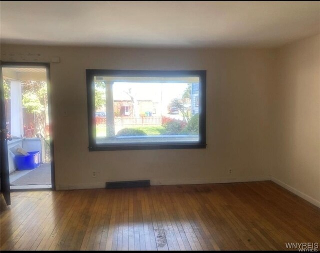 2405 Michigan Ave, Niagara Falls, NY 14305 - empty room featuring visible vents, wood-type flooring, and baseboards