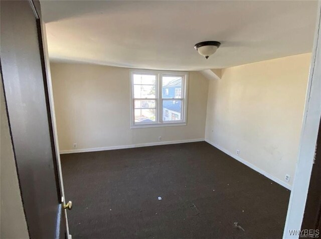 2405 Michigan Ave, Niagara Falls, NY 14305 - unfurnished room featuring baseboards and dark colored carpet