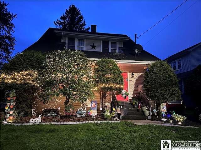 9 Columbia Ave, Ellicott, NY 14701 - view of front of house featuring a chimney and a front lawn