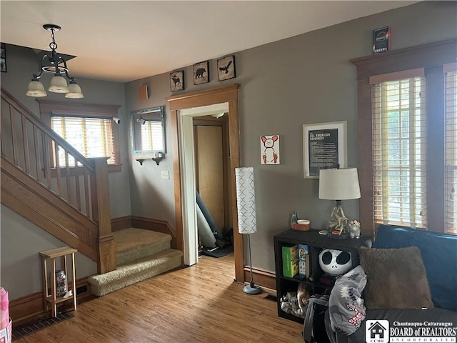 9 Columbia Ave, Ellicott, NY 14701 - interior space featuring baseboards, a chandelier, wood finished floors, and stairs
