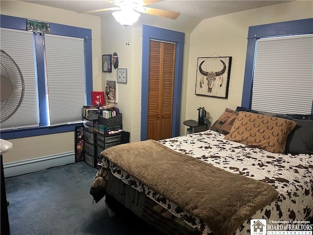 9 Columbia Ave, Ellicott, NY 14701 - carpeted bedroom featuring a baseboard radiator, a closet, and a ceiling fan