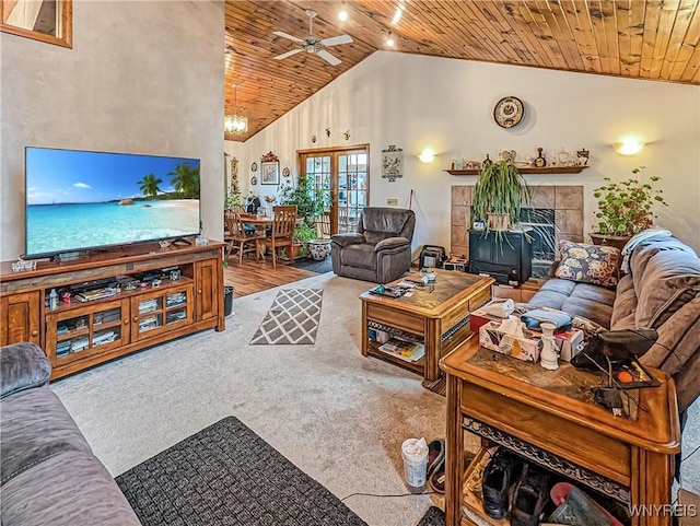 living area with carpet, ceiling fan, wooden ceiling, and high vaulted ceiling