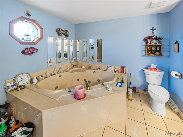 full bathroom featuring a jetted tub, tile patterned flooring, and toilet