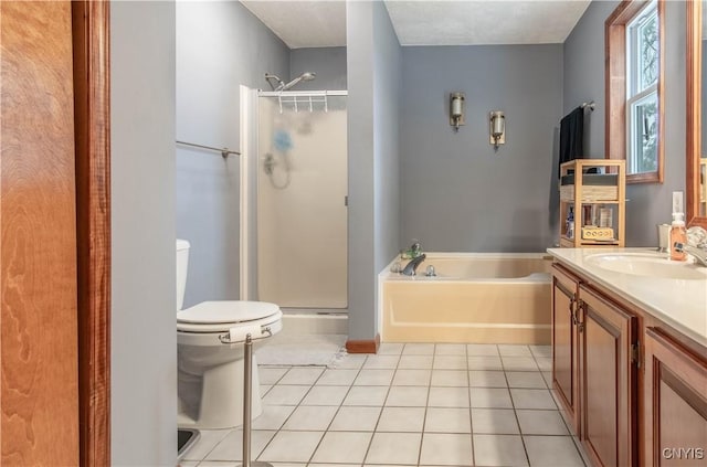 full bath featuring vanity, a bath, toilet, a stall shower, and tile patterned flooring